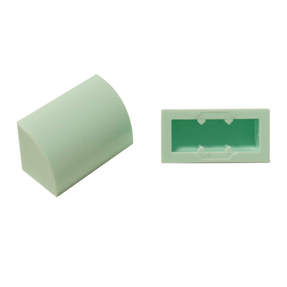 LEGO® Curved 1 x 2 slope with bottom stud holder in light aqua, smooth curved piece for detailed shaping.
