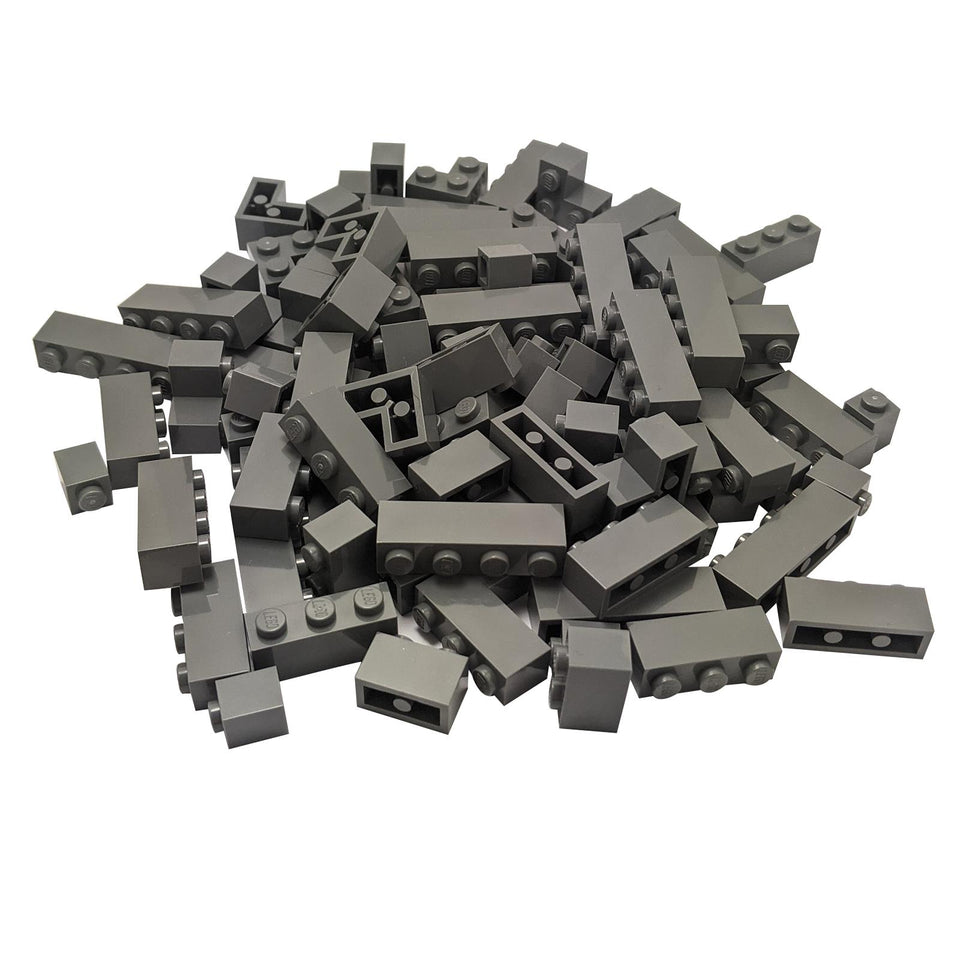 A large pile of 100 brand new, genuine LEGO® dark bluish gray bricks, featuring a mix of 1x1, 1x2, 1x3, 1x4, and corner pieces.