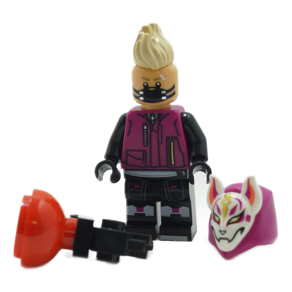 The LEGO Fortnite Drift minifigure (fort007) with his tan mohawk, holding a Grapple Gun, with his iconic Kitsune mask shown separately.