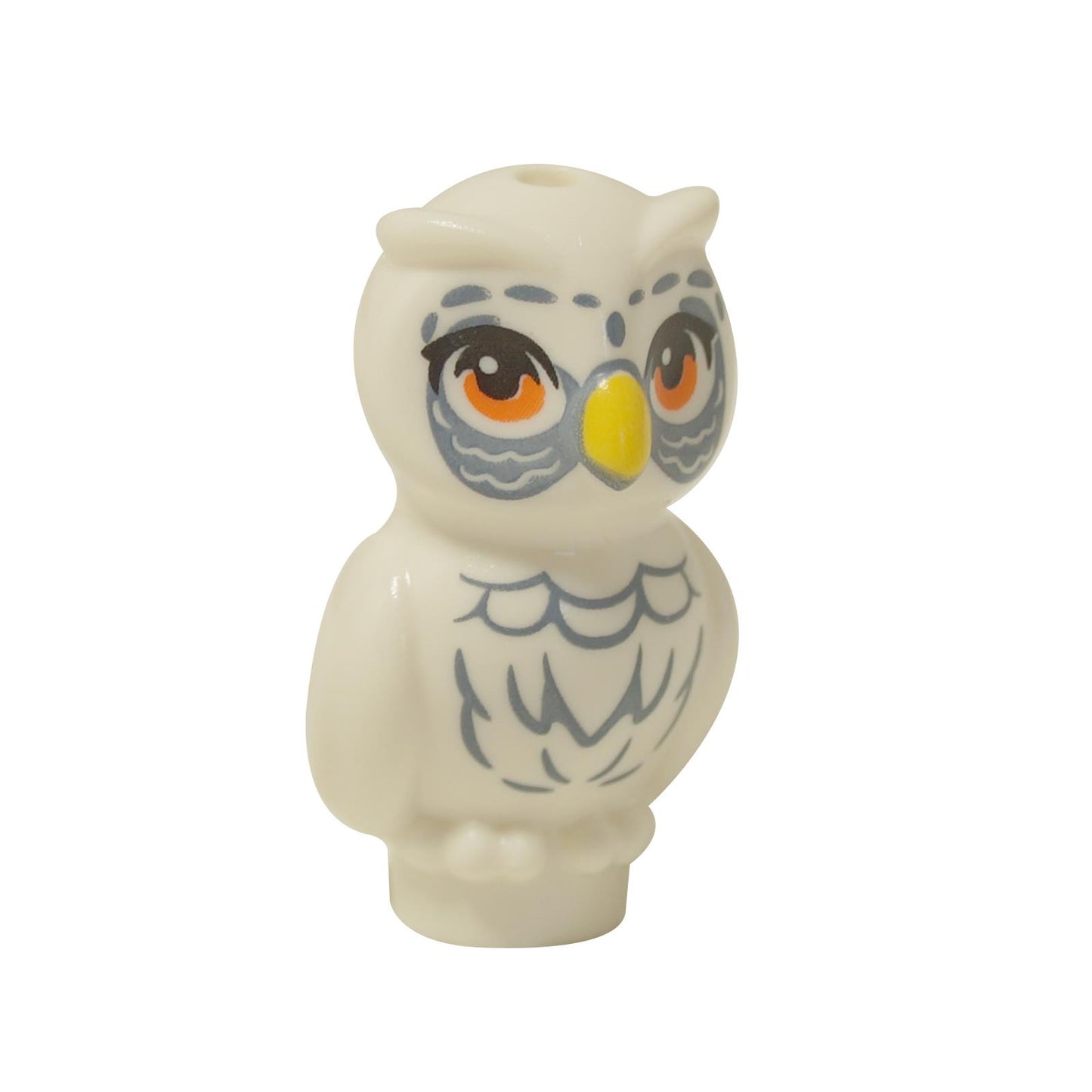  White LEGO® Friends owl figure (21333pb06) standing, with large orange eyes, a yellow beak, and detailed sand blue feather printing on its chest and around its eyes.