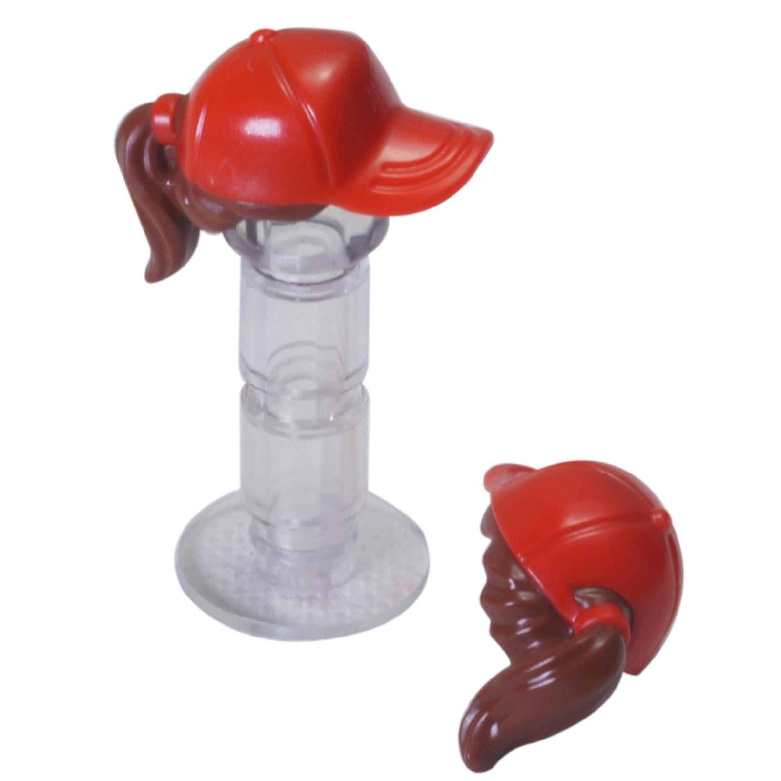 LEGO® minifigure hair piece with red ball cap and brown ponytail, molded headgear hair accessory
