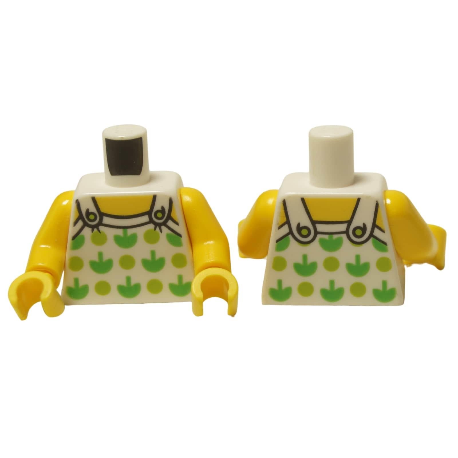 LEGO® Torso (973pb2732c01) con un top halter blanco que presenta un patrón de plantas verdes, mostrado desde el frente y la parte posterior.
