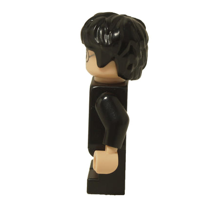 LEGO® Harry Potter minifigure (hp470) in black Hogwarts robe with gray sweater print, showing side profile and black hair.