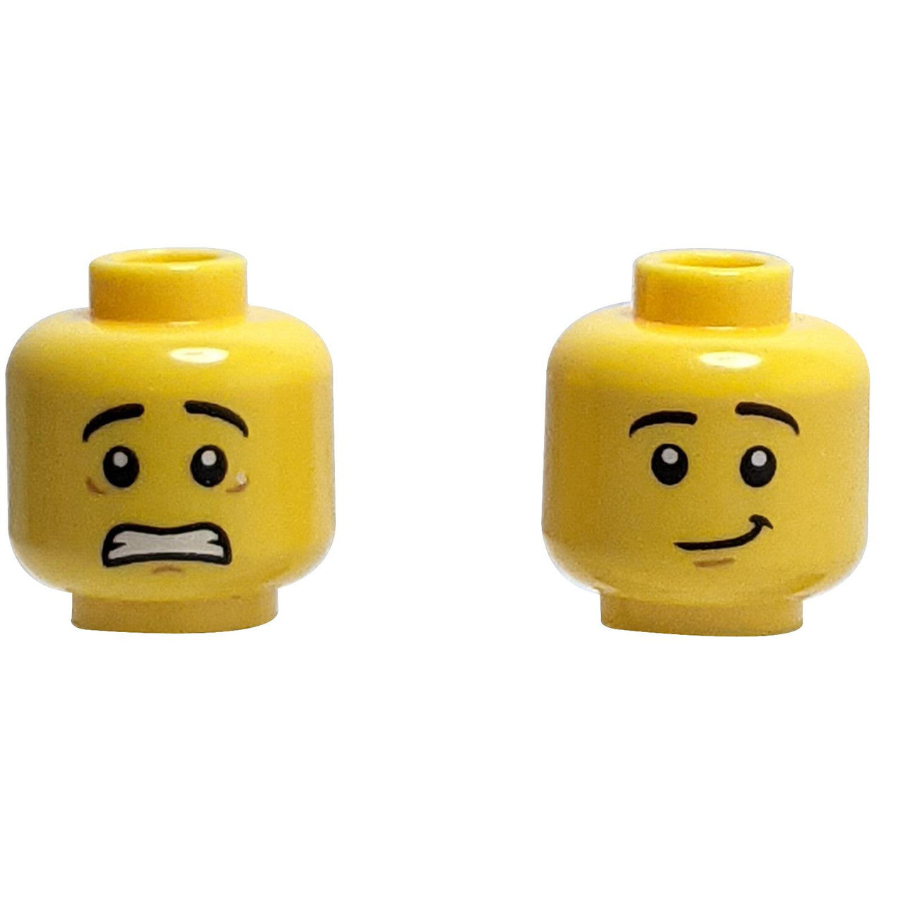 LEGO Minifigure Head, Dual Sided. One side has a scared expression, the other has a relieved, lopsided smile.
