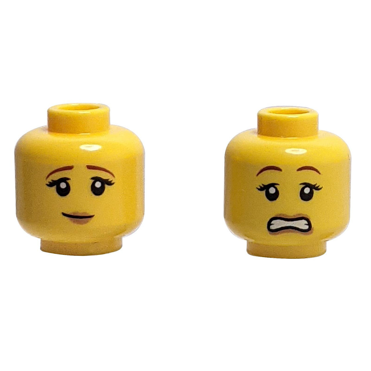 LEGO Minifigure Head, Dual Sided Female. One side has a pensive smile, the other has a scared expression with wide eyes.
