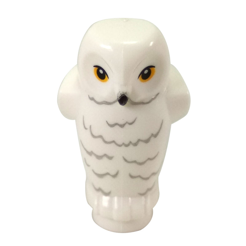 White LEGO Hedwig the Owl figure (Part 92084pb03) shown from the front. It features bright yellow eyes, a small black beak, and detailed gray feather markings across its white body and wings.