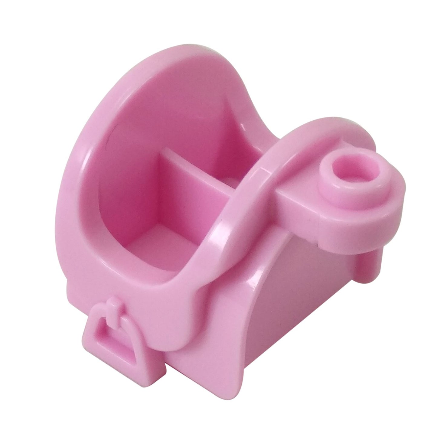 Close-up of a bright pink LEGO horse saddle piece (93086) with molded stirrups and storage slots.