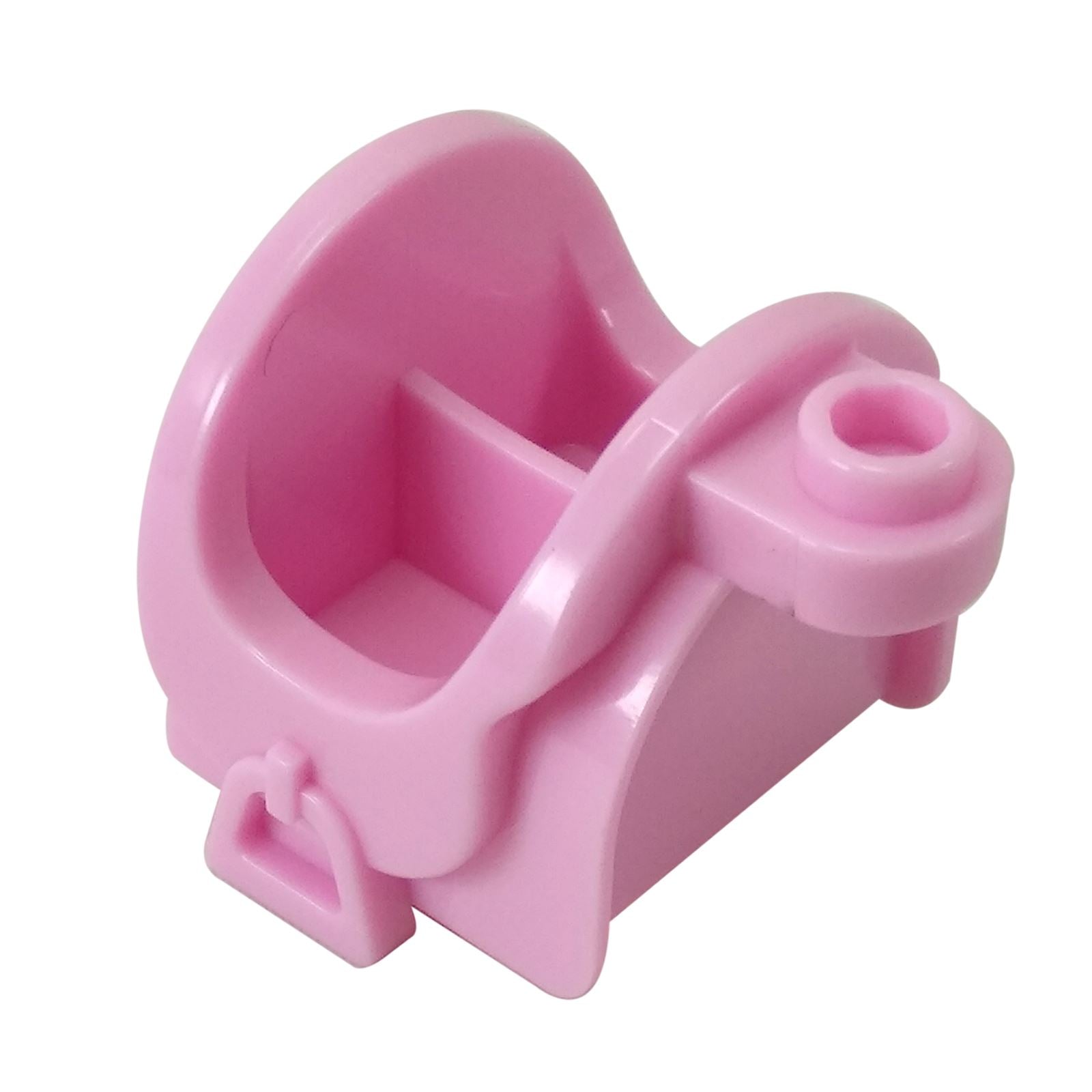 Close-up of a bright pink LEGO horse saddle piece (93086) with molded stirrups and storage slots.