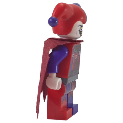 LEGO Nexo Knights Jestro minifigure nex013 with red and purple jester hat and tattered cape. Side profile.