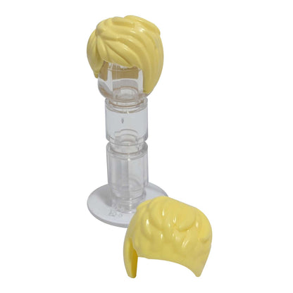 LEGO® minifigure short tousled female hair with side part in bright light yellow, detailed modern hairstyle piece.
