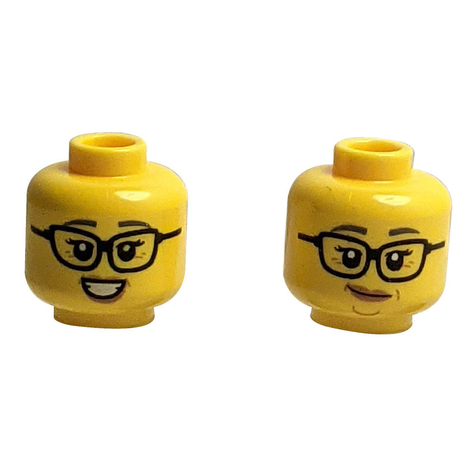 LEGO® Minifigure Female Head (28621pb0198), Dual Sided. Side 1: Confident smirk with glasses. Side 2: Friendly smile with glasses.