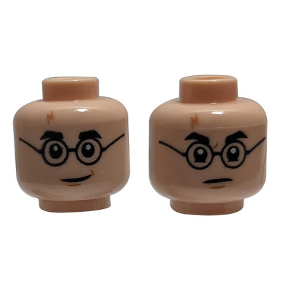 LEGO® Minifigure Head (3626pb2413), Dual Sided. Side 1: Friendly smile with glasses and a lightning scar. Side 2: Angry expression.