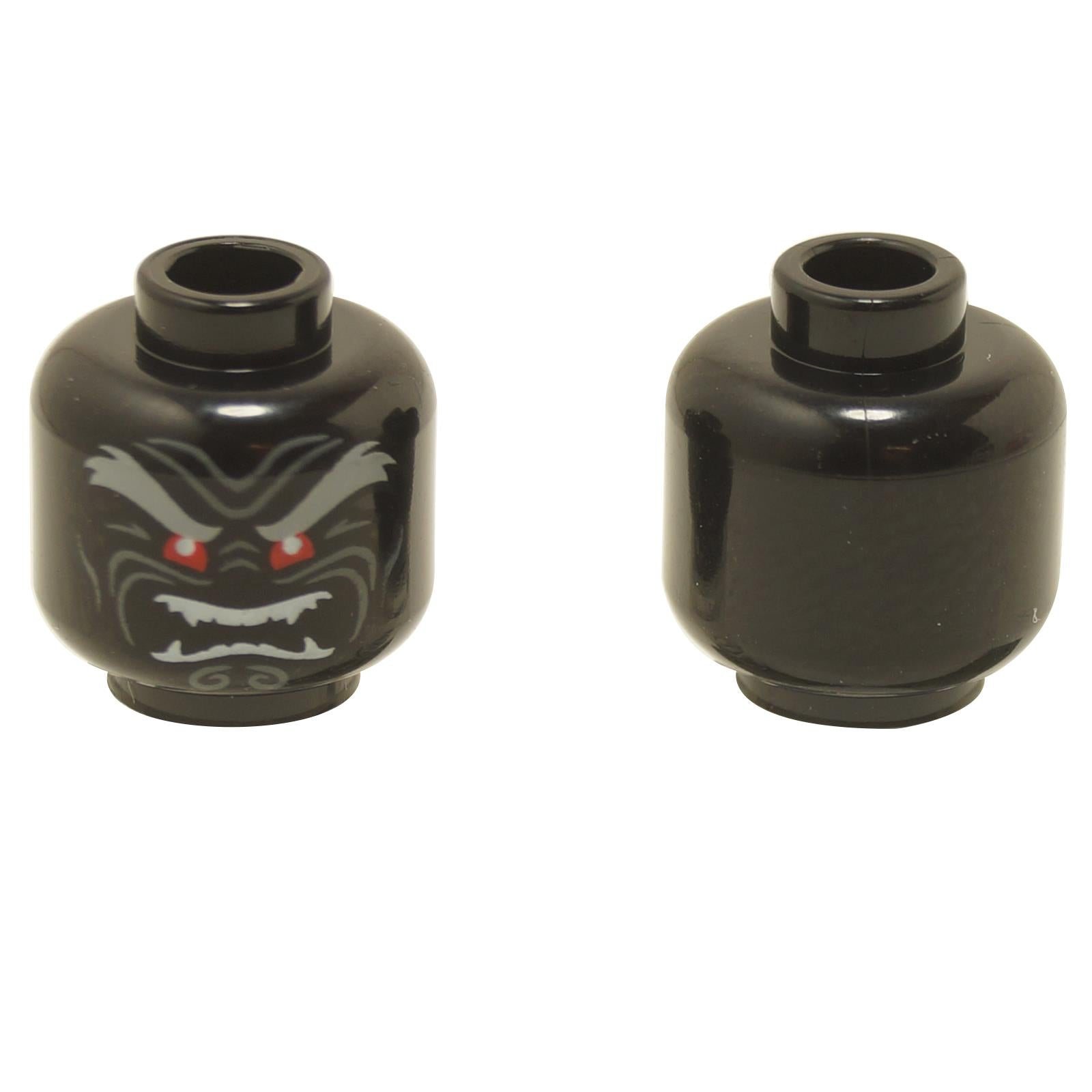 Front and back views of the LEGO® minifigure head (3626pb2296) in black, featuring an evil face with red eyes, sharp fangs, and grey eyebrows, with the reverse side left plain.