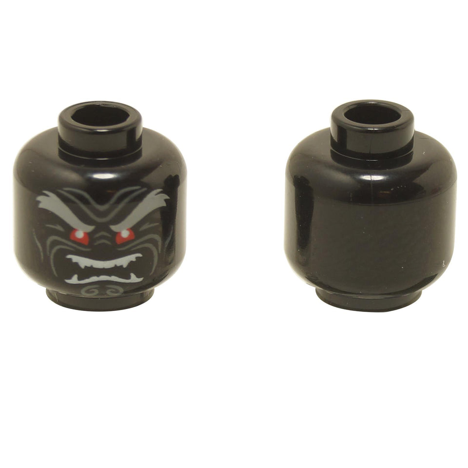 Front and back views of the LEGO® minifigure head (3626pb2296) in black, featuring an evil face with red eyes, sharp fangs, and grey eyebrows, with the reverse side left plain.