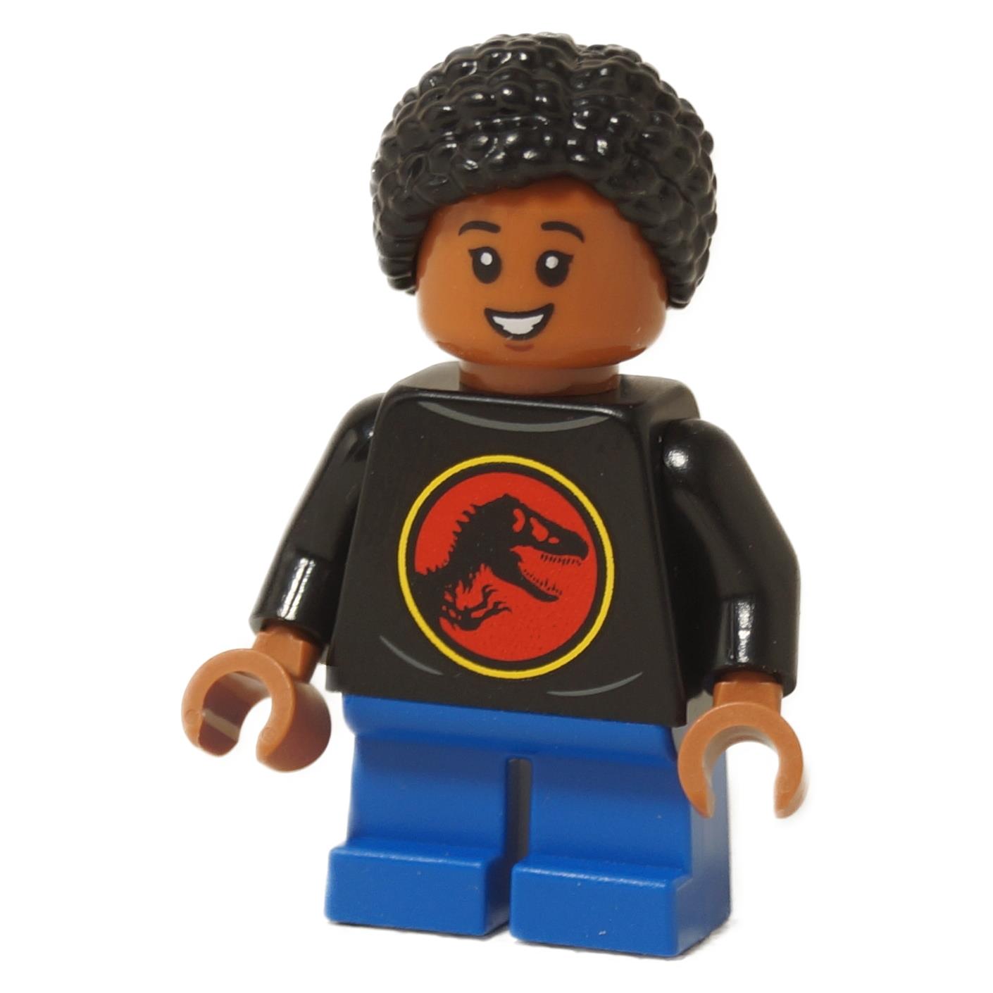 LEGO® Junior Paleontologist girl minifigure with black Jurassic Park logo shirt, blue short legs, and black braided hair, showing teeth
