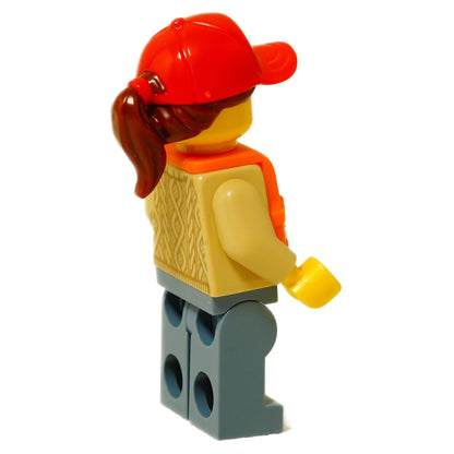LEGO® woman minifigure wearing an orange life jacket, red cap with glasses, light flesh head, and sand blue legs, side profile view
