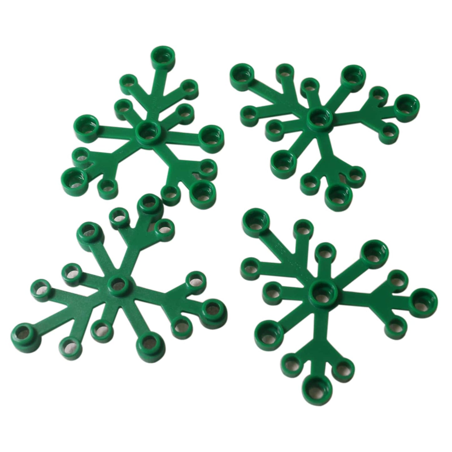 LEGO® Plant Leaves 6 x 5 in green, featuring six curved leaf segments connected at a central hub.
