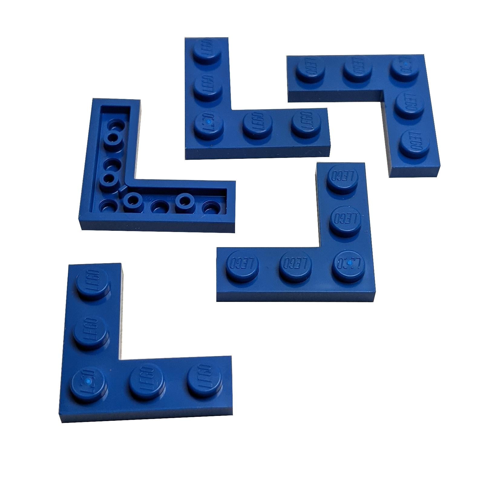 Group of five blue LEGO Plate 3x3 Corner pieces (77844) showing both studded and anti-stud/hollow sides.