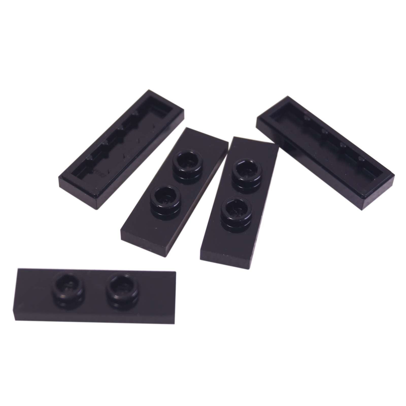 LEGO® Modified Plate 1 x 3 with 2 studs (double jumper) in black, useful for offset building connections.

