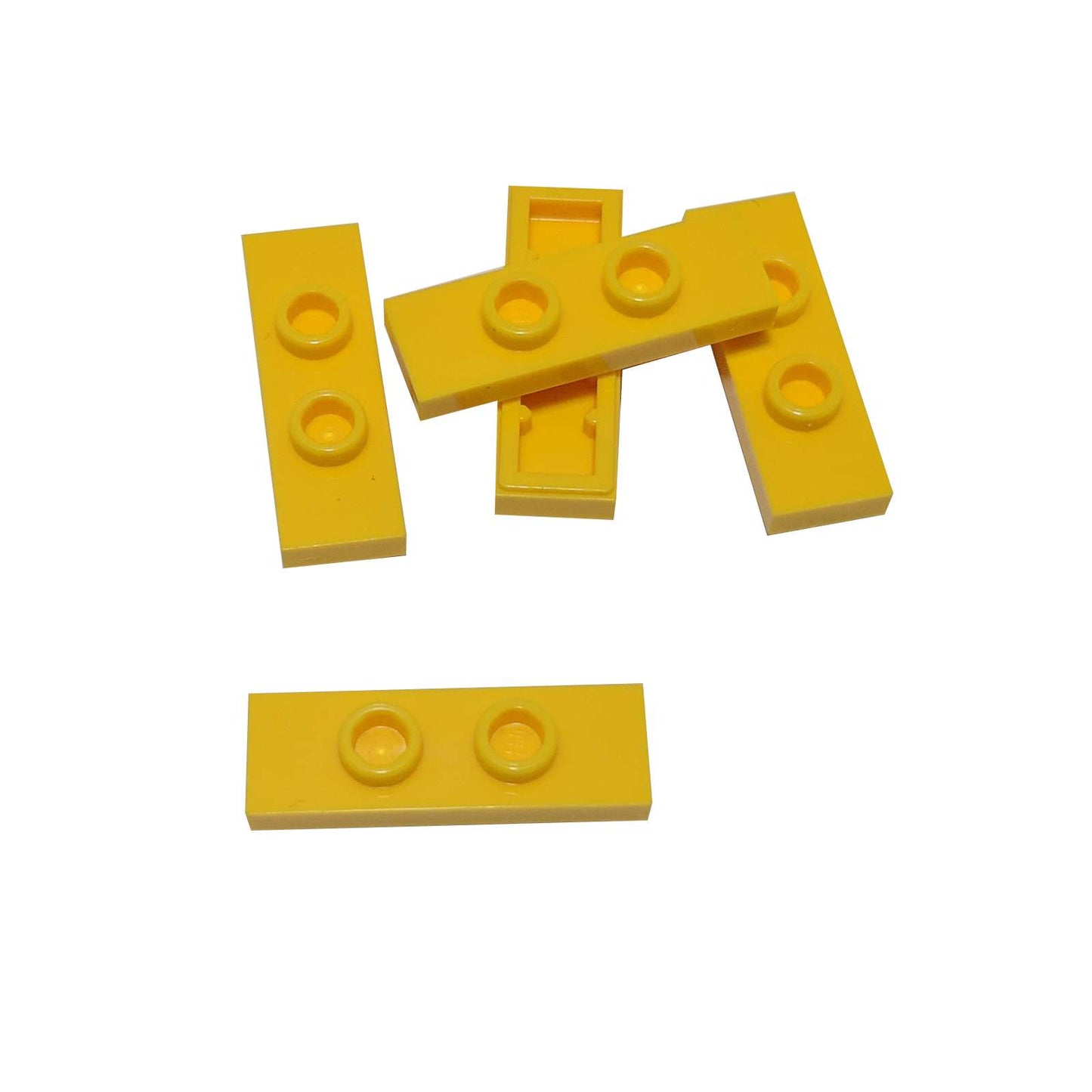 LEGO® Modified Plate 1 x 3 with 2 studs (double jumper) in yellow, useful for offset building connections.
