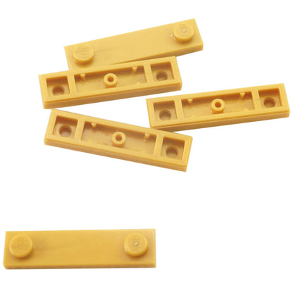 LEGO® Modified Plate 1 x 4 with 2 studs and groove in pearl gold, useful for offset and detailed builds.

