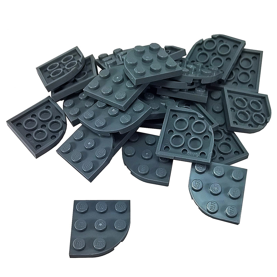Dark bluish gray LEGO® round corner plate 3×3, a curved 90-degree connector piece used for shaping bases and smooth structural edges.
