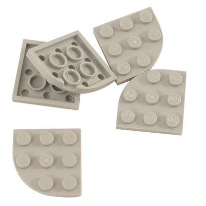 Light gray LEGO® round corner plate 3×3, a curved 90-degree connector piece used for shaping bases and smooth structural edges.

