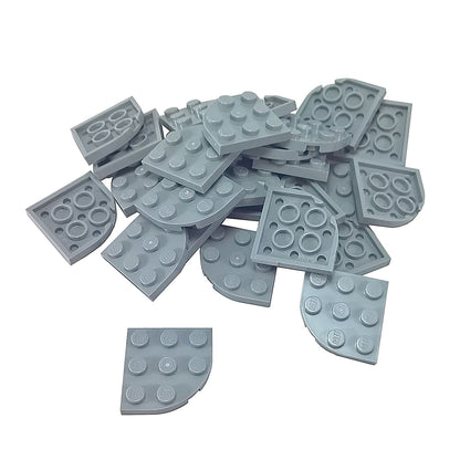 Light bluish gray LEGO® round corner plate 3×3, a curved 90-degree connector piece used for shaping bases and smooth structural edges.

