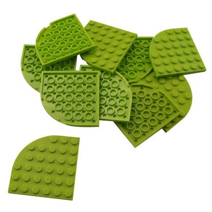 LEGO® Pyöreä Kulmapala 6 x 6 (6003) limenvihreänä, suuri kaareva kulmapala, jota käytetään sileissä pyöreissä rakennelmissa.
