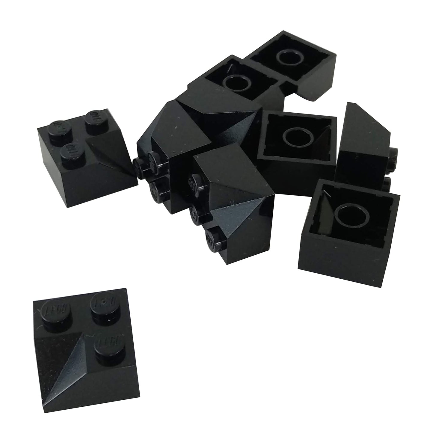 LEGO® Slope 45 2 x 2 Double Concave (3046a) in black, featuring two inward-curving angled slopes forming a recessed shape.
