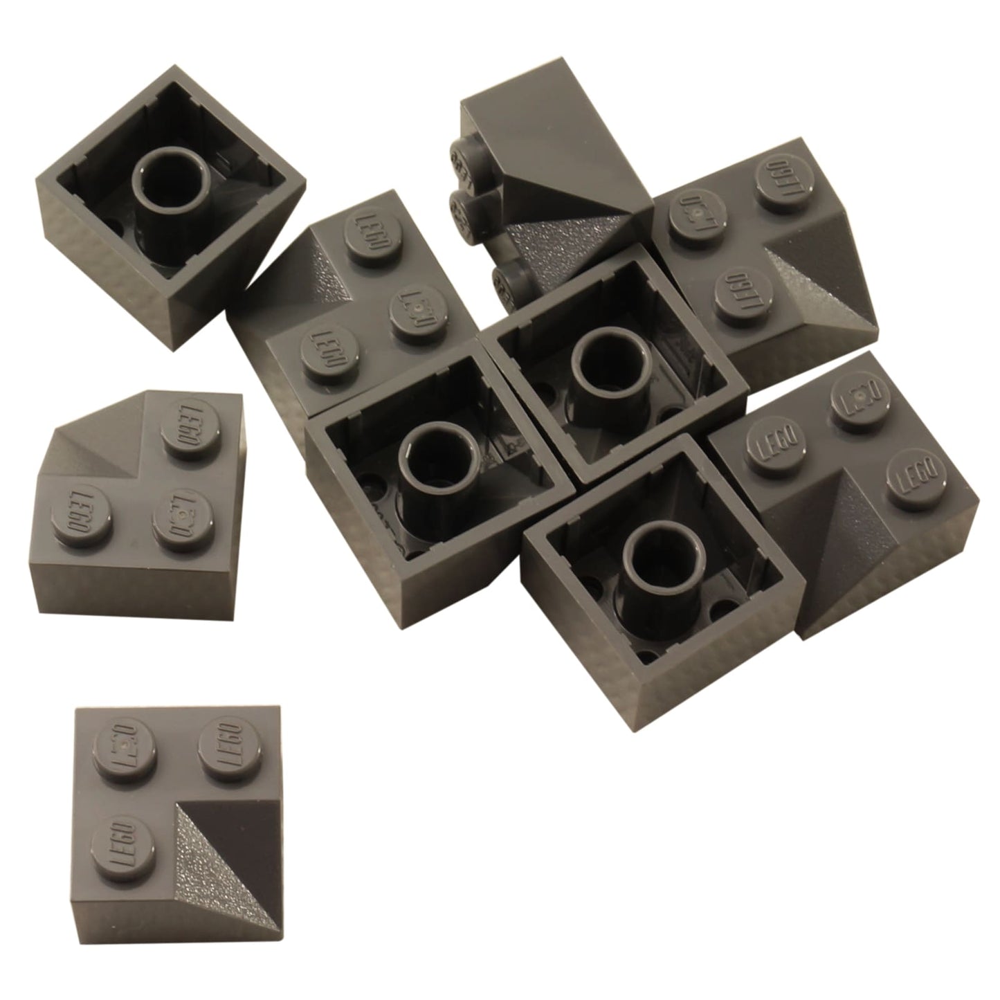 LEGO® Slope 45 2 x 2 Double Concave (3046a) in dark bluish gray, featuring two inward-curving angled slopes forming a recessed shape.
