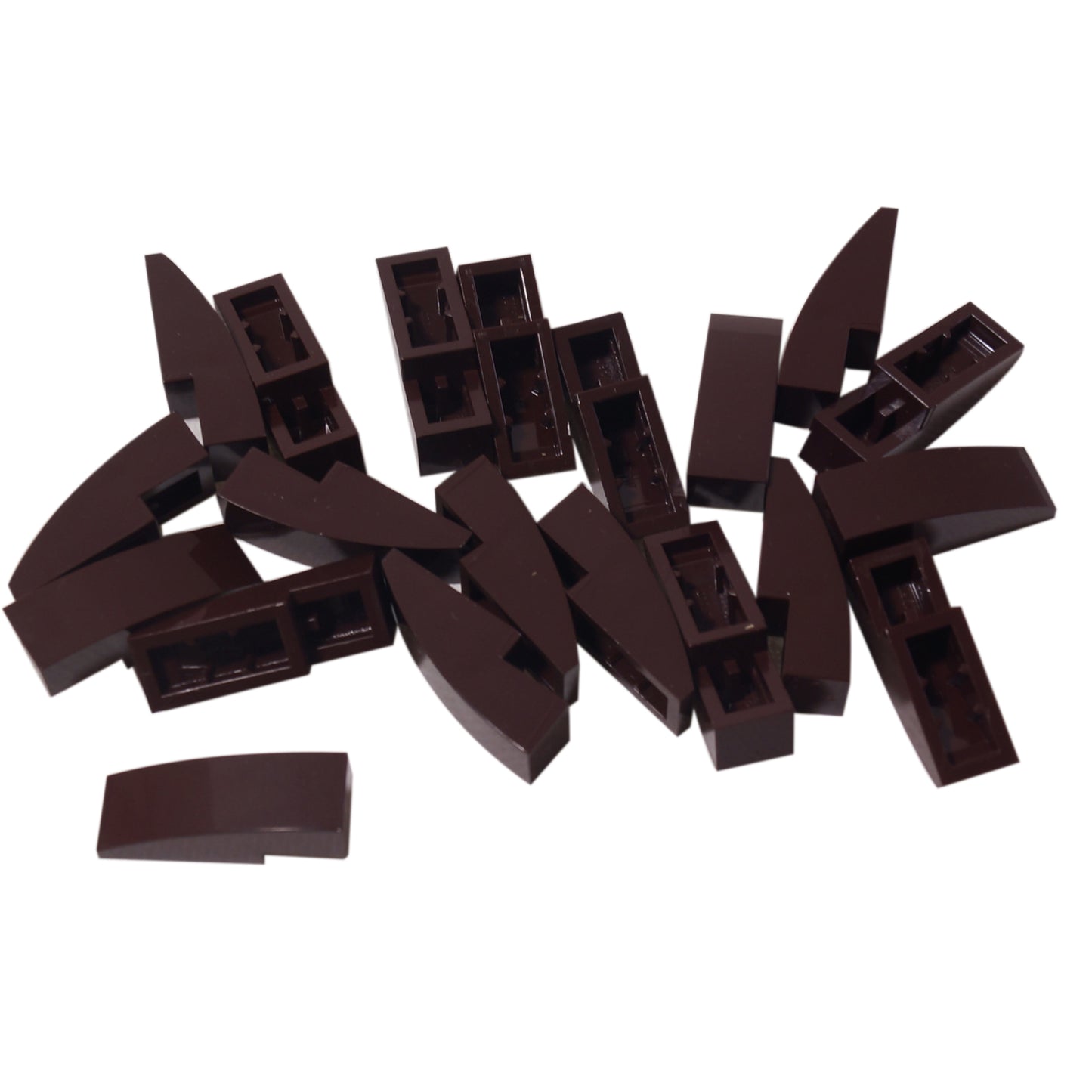 Close-up of LEGO® Slope, Curved 3 x 1 (50950) in dark brown, featuring a smooth curved design ideal for vehicle bodies, architecture, and decorative detailing.
