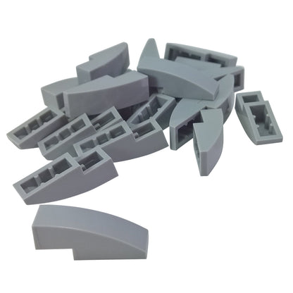 Close-up of LEGO® Slope, Curved 3 x 1 (50950) in light bluish gray, featuring a smooth curved design ideal for vehicle bodies, architecture, and decorative detailing.
