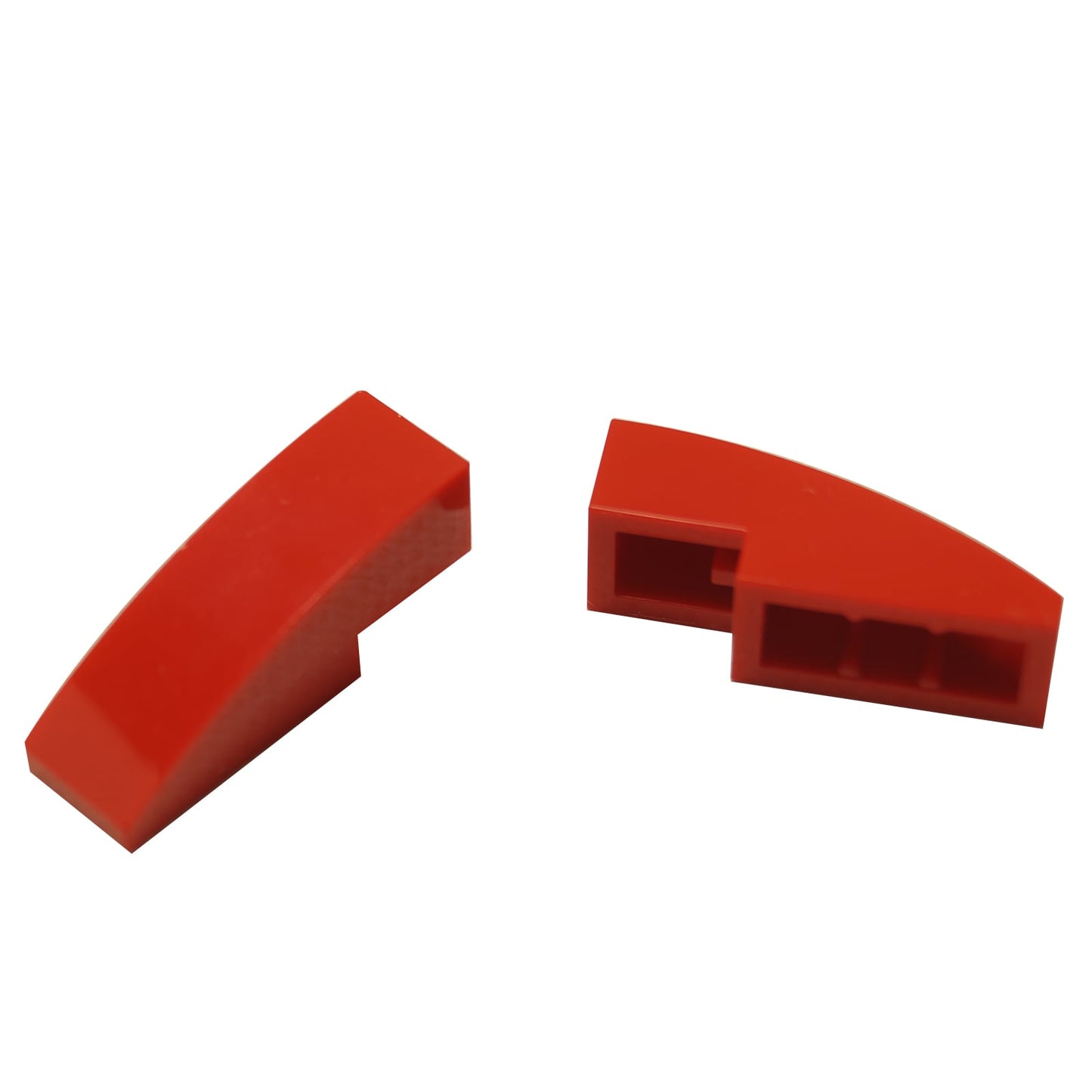 Close-up of LEGO® Slope, Curved 3 x 1 (50950) in red, featuring a smooth curved design ideal for vehicle bodies, architecture, and decorative detailing.
