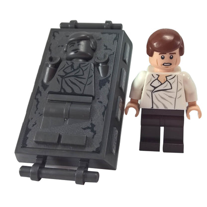 LEGO® Star Wars Han Solo sw0714 with White shirt and Dark Brown legs alongside Pearl Dark Gray Han Solo with carbonite block
