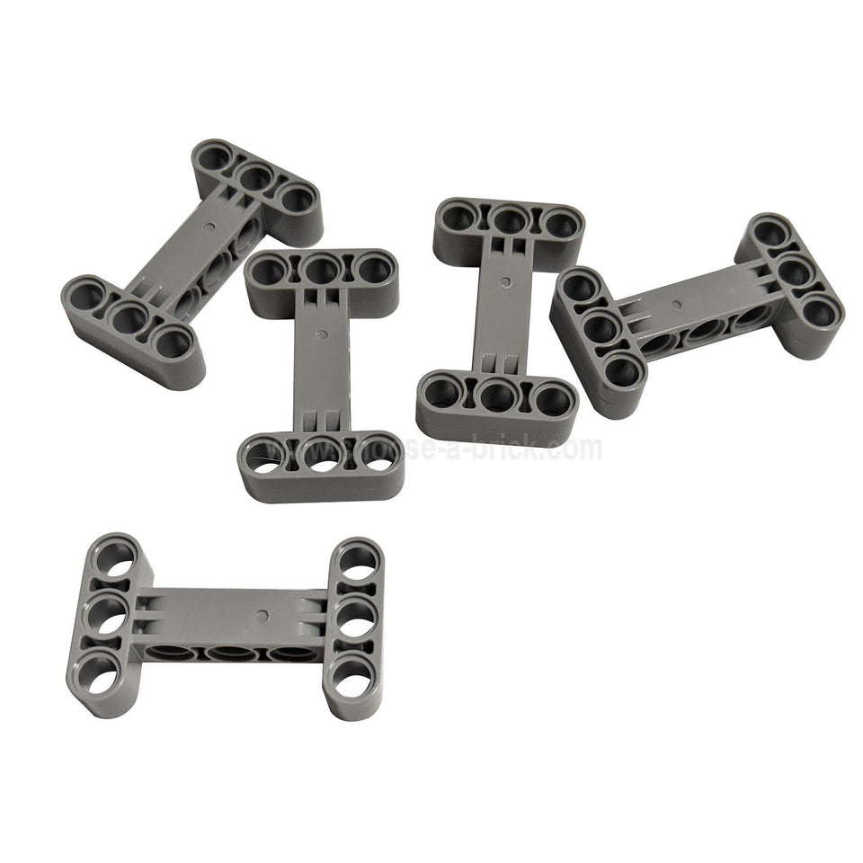 Five dark bluish gray LEGO Technic Frame 3 x 5 (Part 32531), showcasing its sturdy H-shape design and multiple pin holes for strong structural connections.