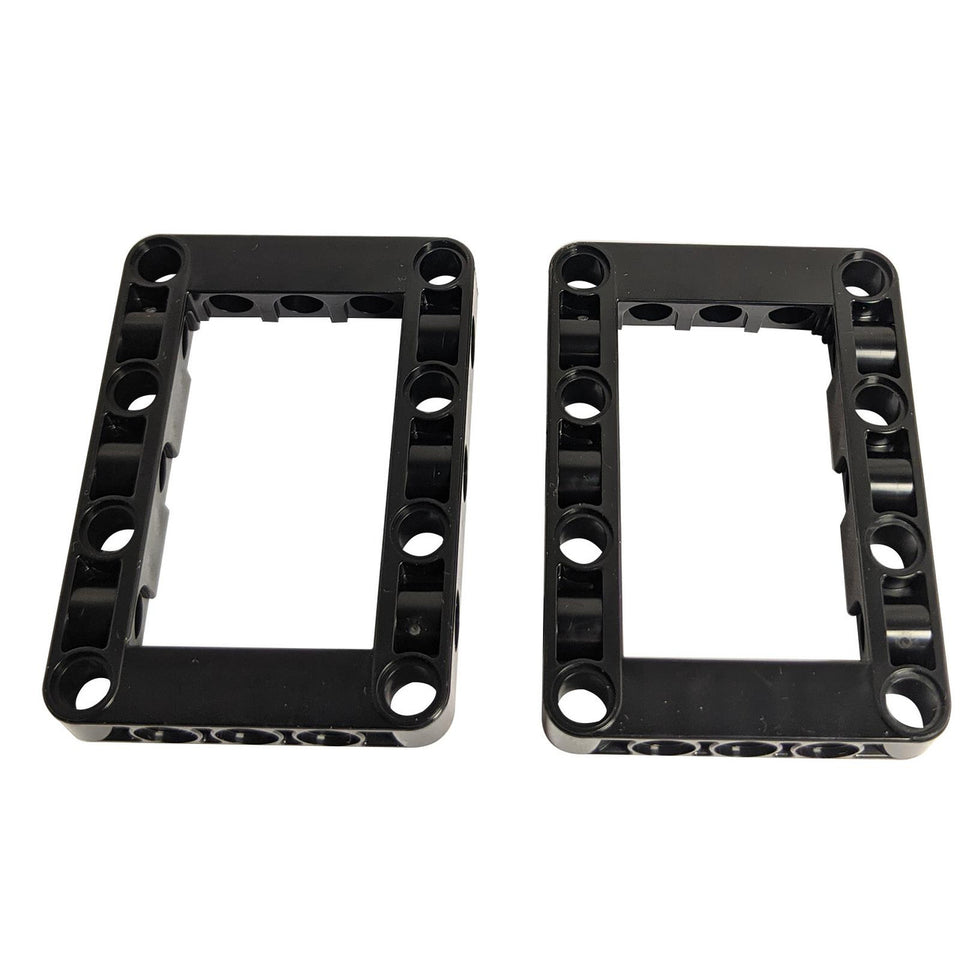 Two black LEGO Technic Modified Frame Thick 5 x 7 Open Center pieces (Part 64179), viewed from the front, showcasing their sturdy rectangular shape with internal pin holes and a large open middle.