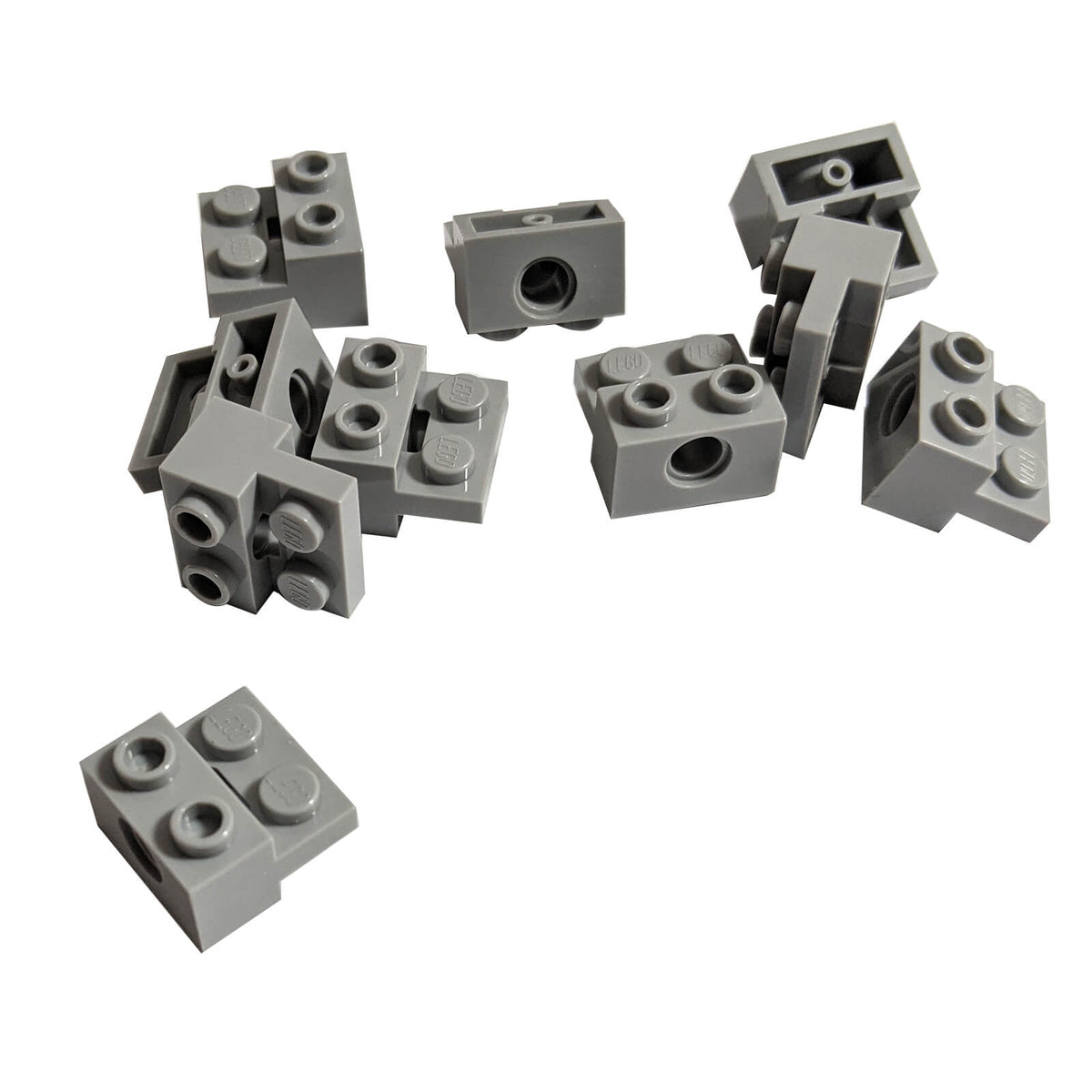 Light bluish grey LEGO Technic modified brick 73109 with 1 x 2 hole section and attached 1 x 2 plate, multiple pieces shown