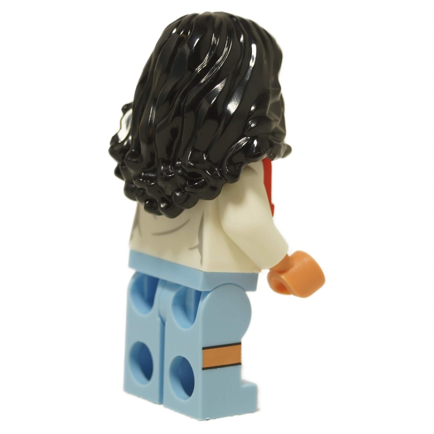 Back view of the LEGO Teresa Delgado minifigure showing her long, wavy black hair and light blue legs.