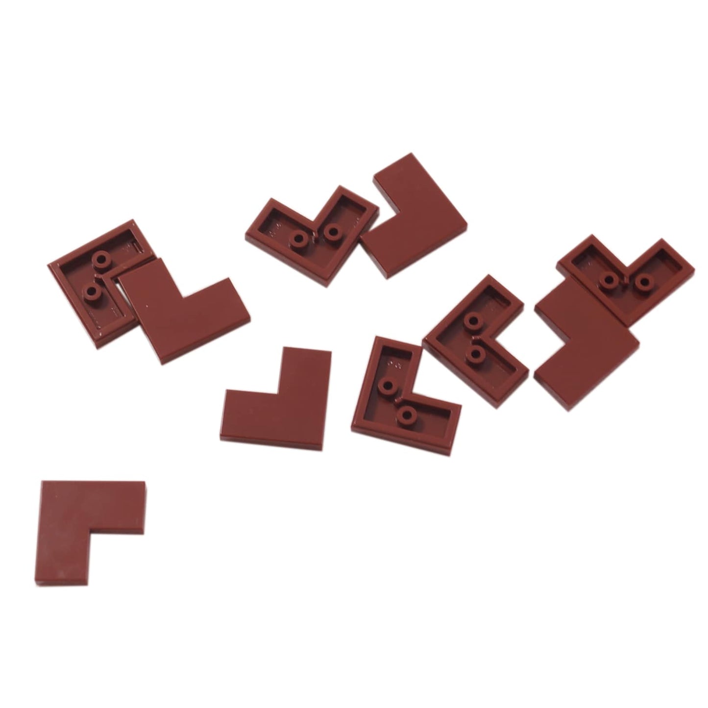 LEGO® tile 2 x 2 corner piece with smooth surface, used for angled floors and clean edges, reddish brown color

