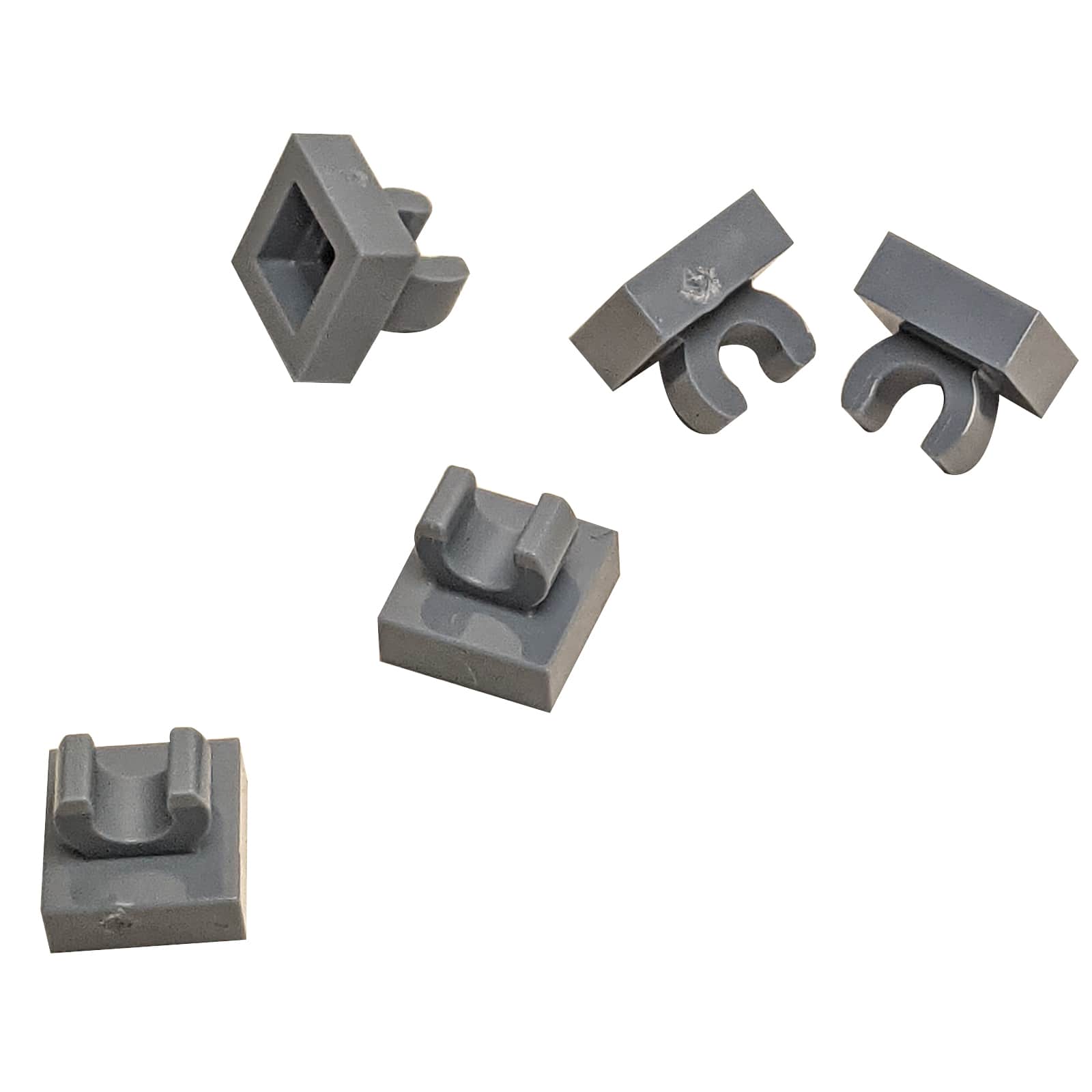 LEGO® Tile Modified 1 x 1 with open O clip (15712) in dark bluish gray, a small connector tile with a circular side clip.

