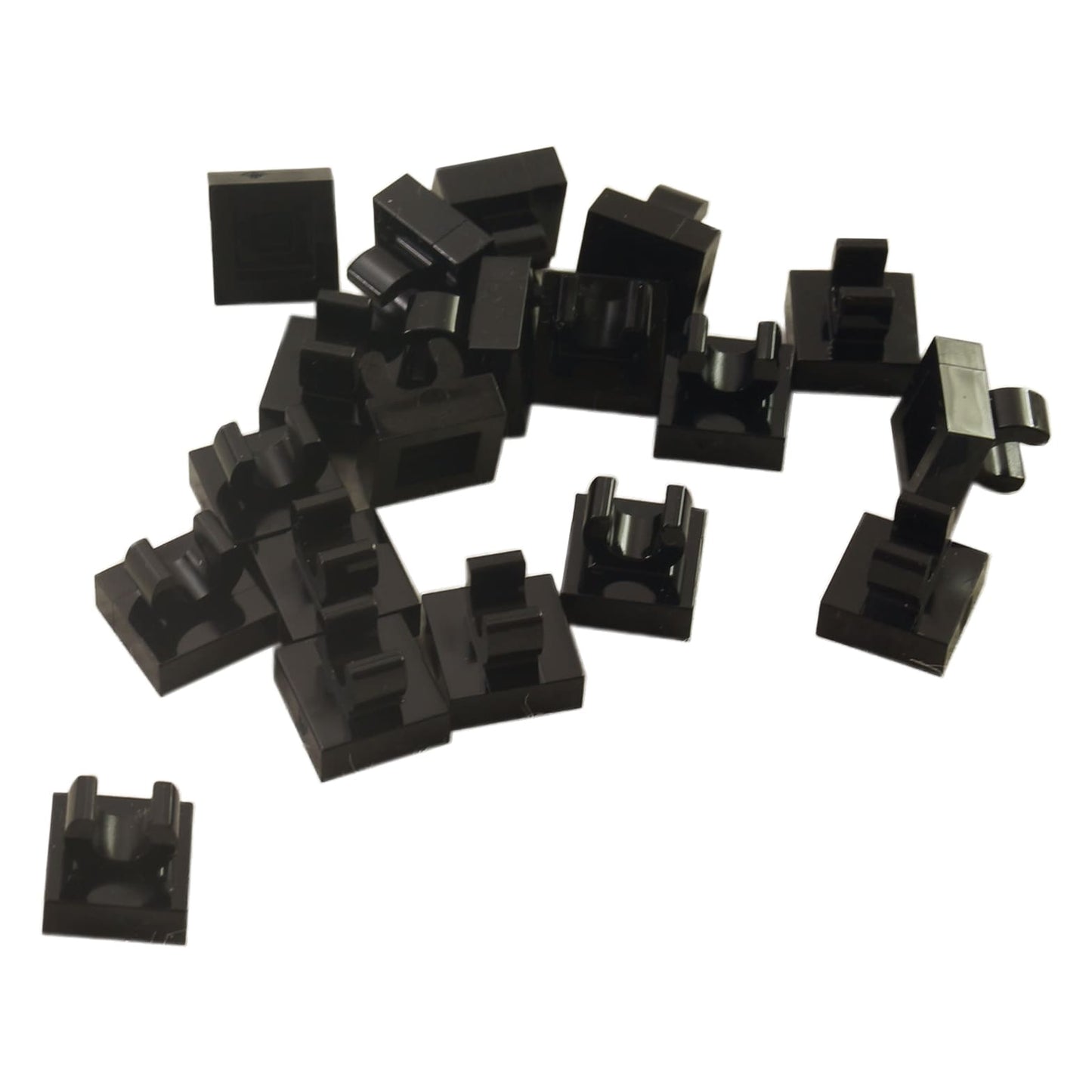 LEGO® Tile Modified 1 x 1 with open O clip (15712) in black, a small connector tile with a circular side clip.
