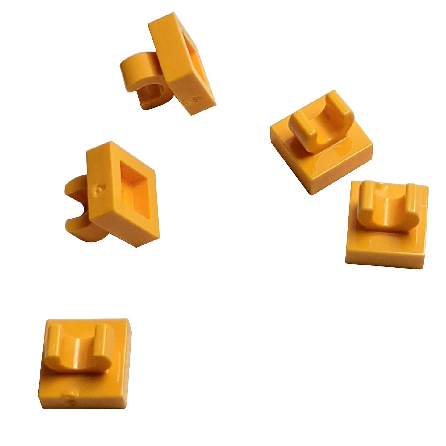 LEGO® Tile Modified 1 x 1 with open O clip (15712) in bright light orange, a small connector tile with a circular side clip.
