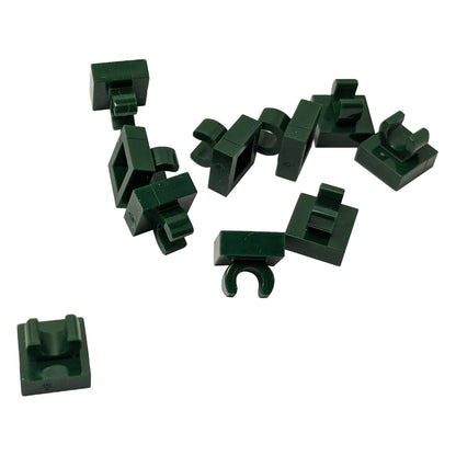 LEGO® Tile Modified 1 x 1 with open O clip (15712) in dark green, a small connector tile with a circular side clip.
