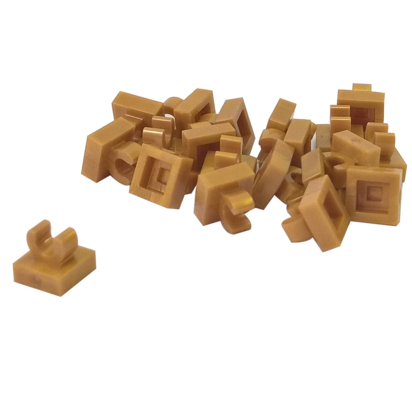 LEGO® Tile Modified 1 x 1 with open O clip (15712) in pearl gold, a small connector tile with a circular side clip.
