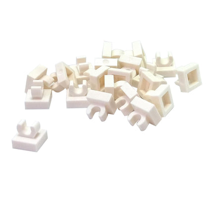LEGO® Tile Modified 1 x 1 with open O clip (15712) in white, a small connector tile with a circular side clip.
