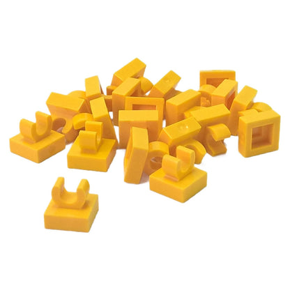 LEGO® Tile Modified 1 x 1 with open O clip (15712) in yellow, a small connector tile with a circular side clip.

