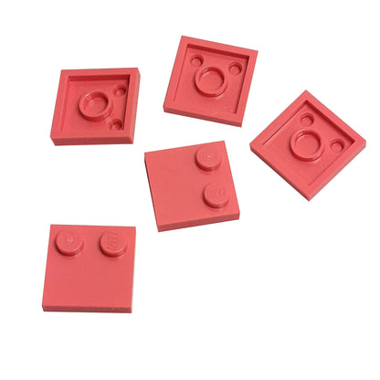 LEGO® Tile, Modified 2 x 2 with Studs on Edge (Part 33909) in coral, used for SNOT techniques and detailed surface building
