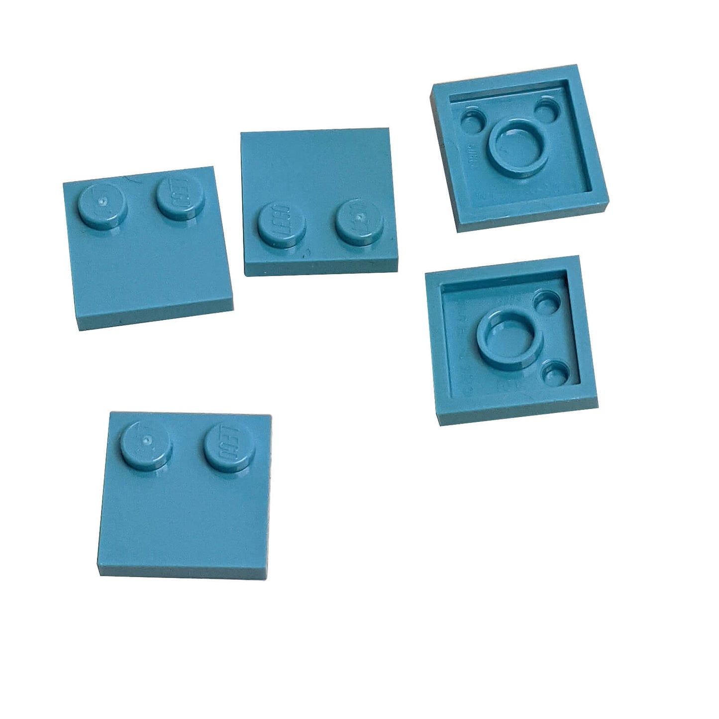 LEGO® Tile, Modified 2 x 2 with Studs on Edge (Part 33909) in medium azure, used for SNOT techniques and detailed surface building
