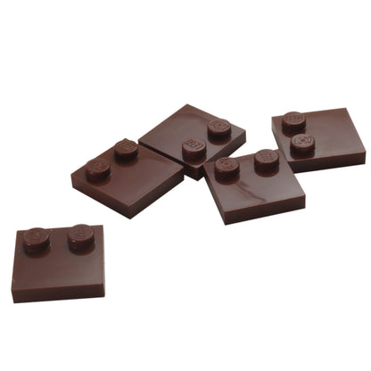 LEGO® Tile, Modified 2 x 2 with Studs on Edge (Part 33909) in reddish brown, used for SNOT techniques and detailed surface building

